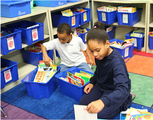 Kids sorting books in Book Bins