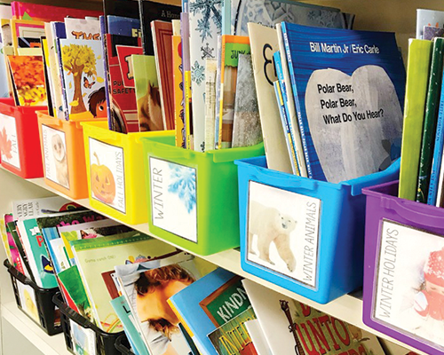 Kids sorting books in Book Bins